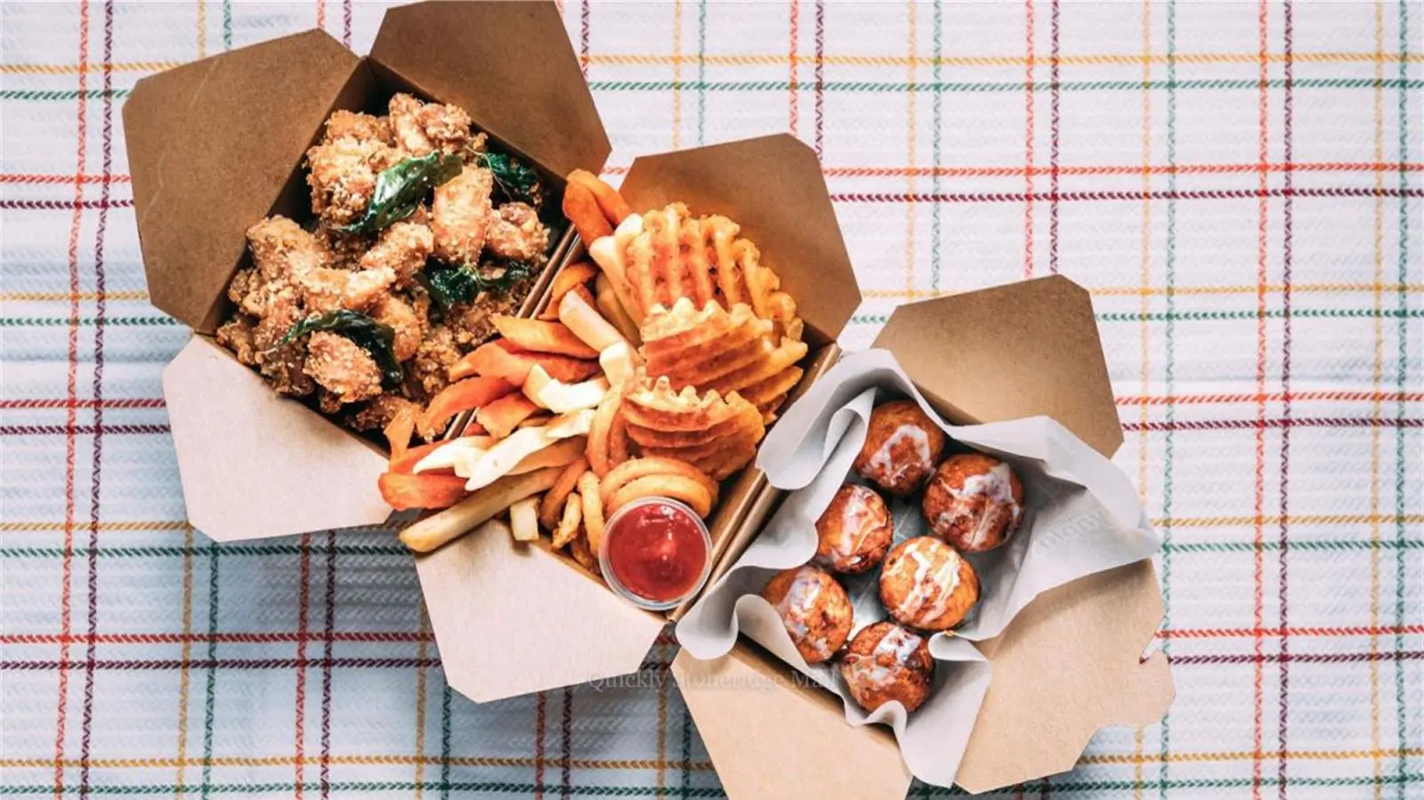 Fried chicken, assorted fries, and doughnut holes in boxes at Quickly Stoneridge Mall, a Fast Food Restaurant in Pleasanton